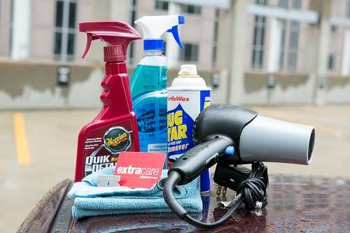 Cleaning supplies used to remove a sticker from a car