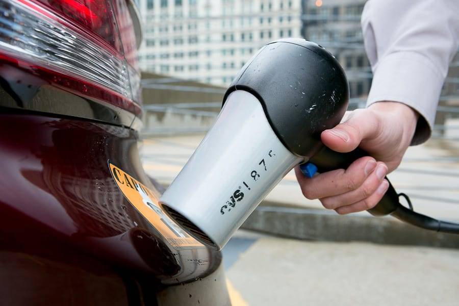 Using a hair dryer to remove a sticker from a car